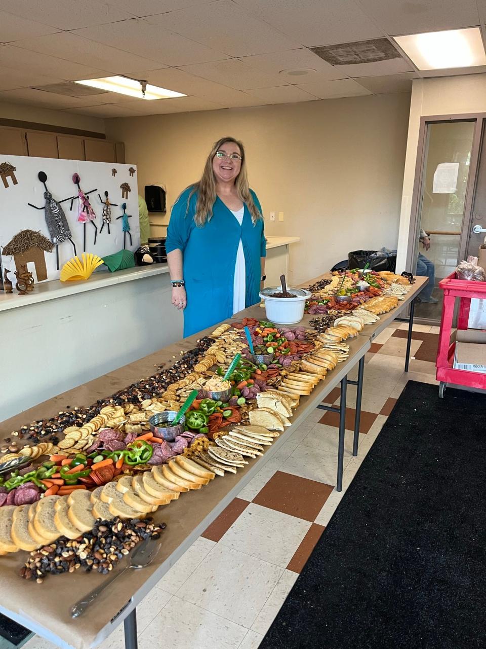 Tammy Johnson, service coordinator for Summit Towers, puts the finishing touches on the Juneteenth Celebration buffet spread. Johnson requested a presentation from the Knoxville Area Urban League, so that residents would better know what they’re celebrating.