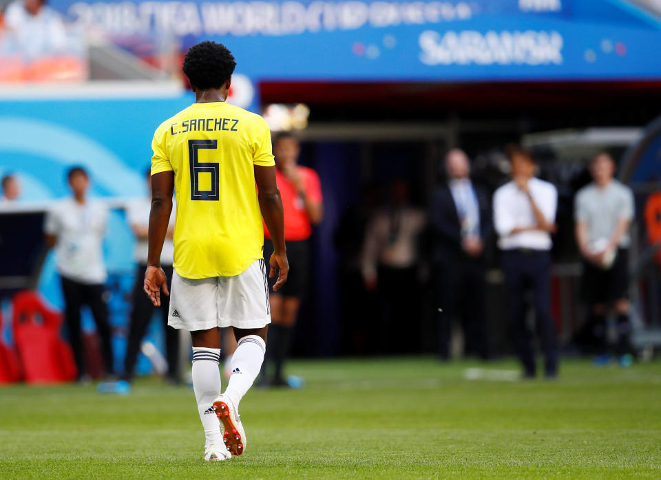 <p>Colombia’s Carlos Sanchez walks off after being sent off </p>