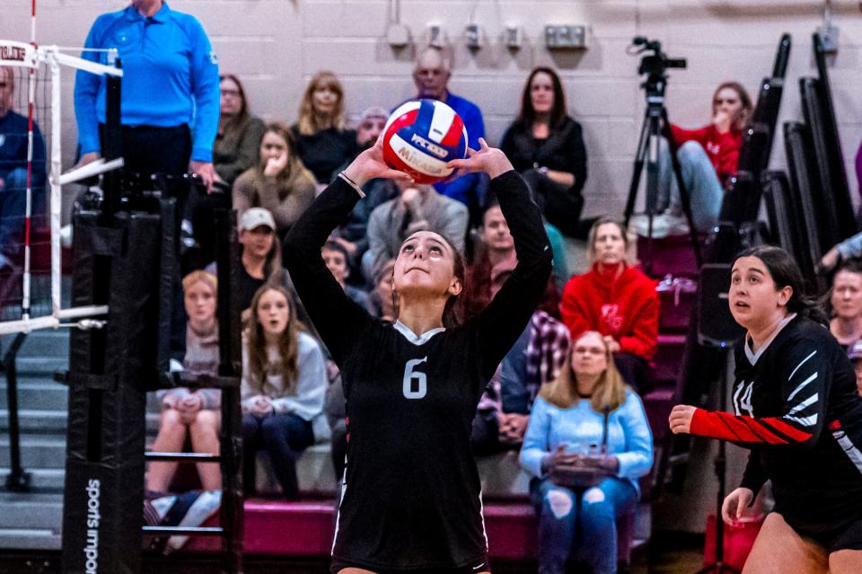 Old Rochester's Aubrie Letourneau sets up an outside hitter during a match in 2022.