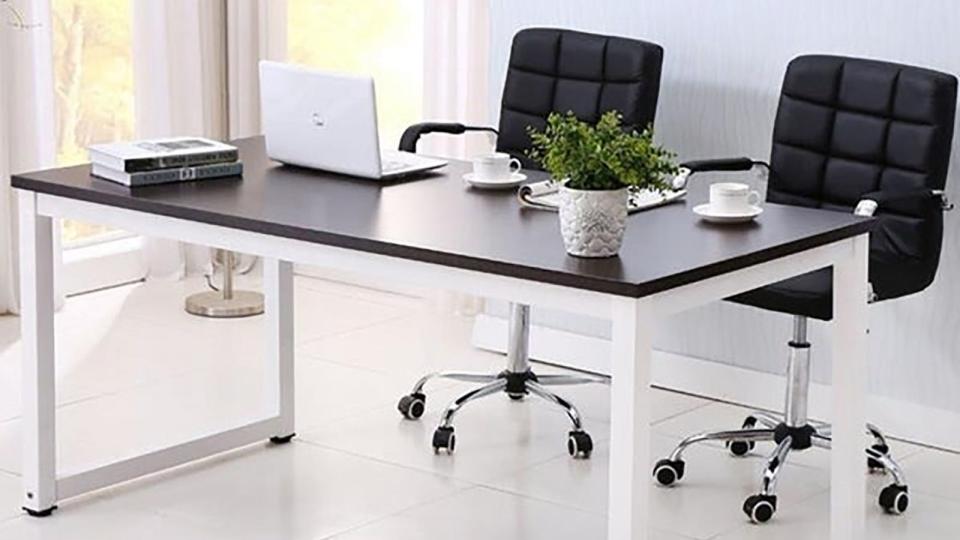 This computer desk is a stylish addition to the home office.