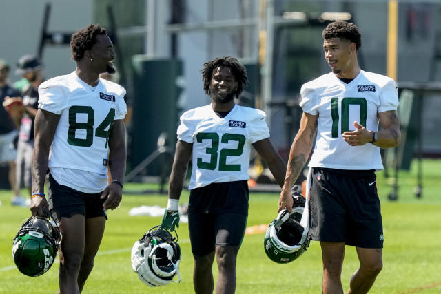 New York Jets running back Michael Carter (32) looks on against