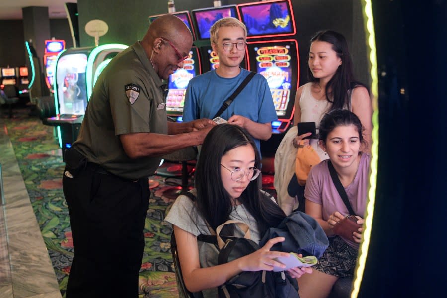 <em>Hospitality Hero Park MGM security guard James Brewster Thompson checks the IDs of young customers Tuesday, August 15, 2023, at Park MGM in Las Vegas, Nevada. (Sam Morris, LVCVA Archive)</em>