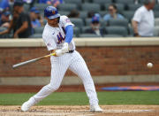 New York Mets third baseman Brandon Drury (35) hits a single against the Atlanta Braves during the second inning of a baseball game Thursday, July 29, 2021, in New York. (AP Photo/Noah K. Murray)