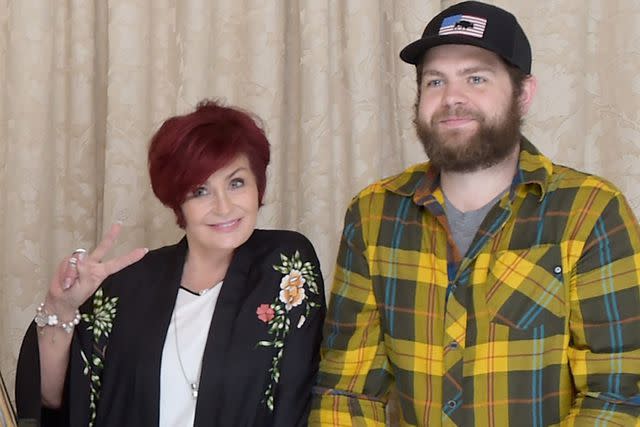 Kevin Winter/Getty for Live Nation Sharon Osbourne and son Jack Osbourne pose as Ozzy Osbourne announces No More Tours 2" Final World Tour at press conference in 2018