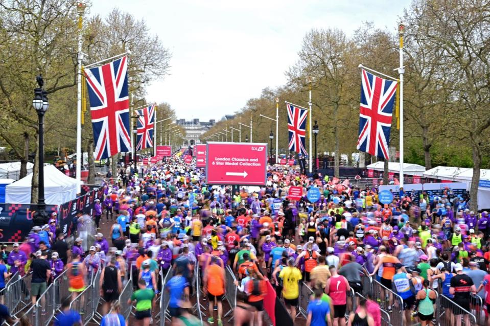 Runners reach the finish of the 2023 London Marathon (AFP via Getty Images)