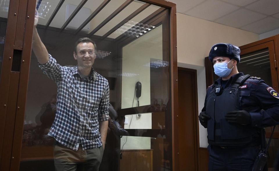 PHOTO: In this Feb. 20, 2021, file photo, Russian opposition leader Alexei Navalny stands inside a glass cell during a court hearing at the Babushkinsky district court in Moscow. (Kirill Kudryavtsev/AFP via Getty Images, FILE)