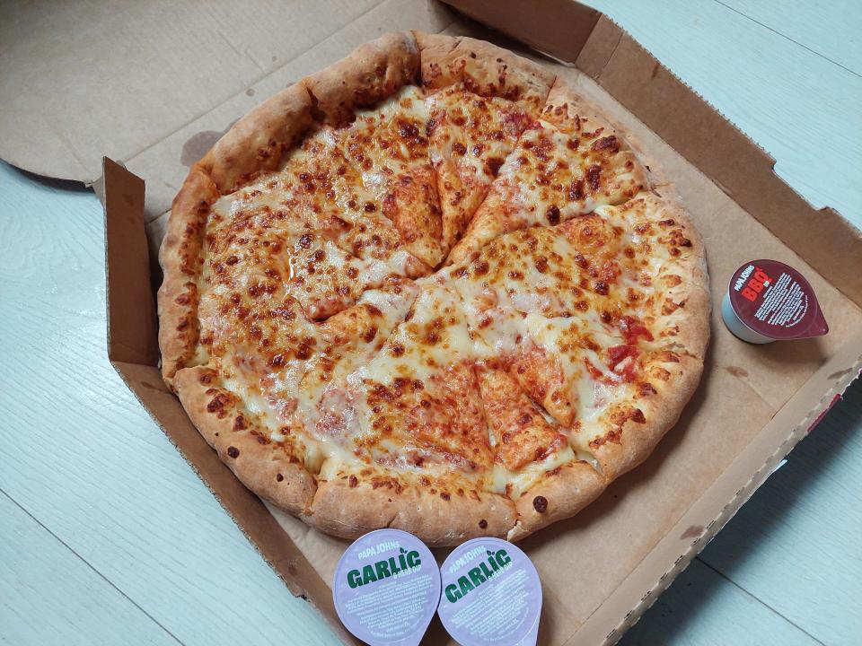 Cheese and tomato pizza from Papa John's, displayed in a box