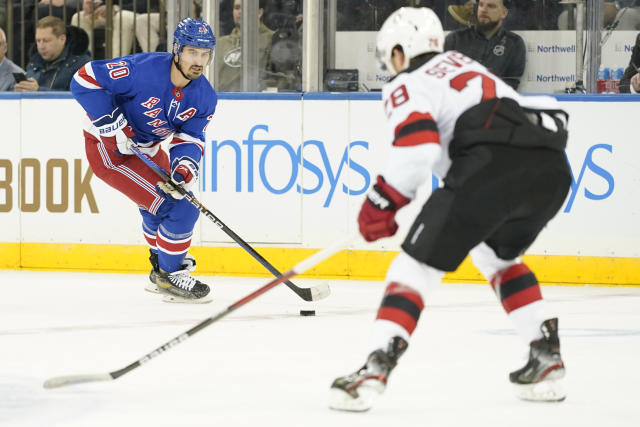 Rangers win 4-3 in OT to end Devils' 11-game road win streak - Seattle  Sports