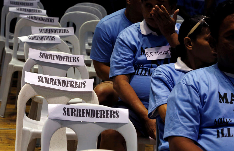 <p>Residents involved with illegal drugs wait for fellow surrenderees before taking a pledge that they will not use or sell “Shabu” (Meth) again after surrendering to police and government officials in Makati, metro Manila, Philippines on Aug.18, 2016. (REUTERS/Erik De Castro) </p>