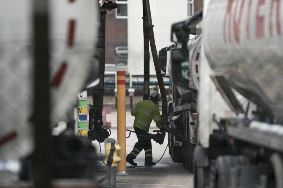 Fuel tankers are filled at the Valero Manchester Terminal, in Manchester, England, Tuesday, Sept. 28, 2021. Thousands of British gas stations have run dry, as motorists scrambled to fill up amid a supply disruption due to a shortage of truck drivers. Long lines of vehicles formed at many gas stations over the weekend, and tempers frayed as some drivers waited for hours. (AP Photo/Jon Super)