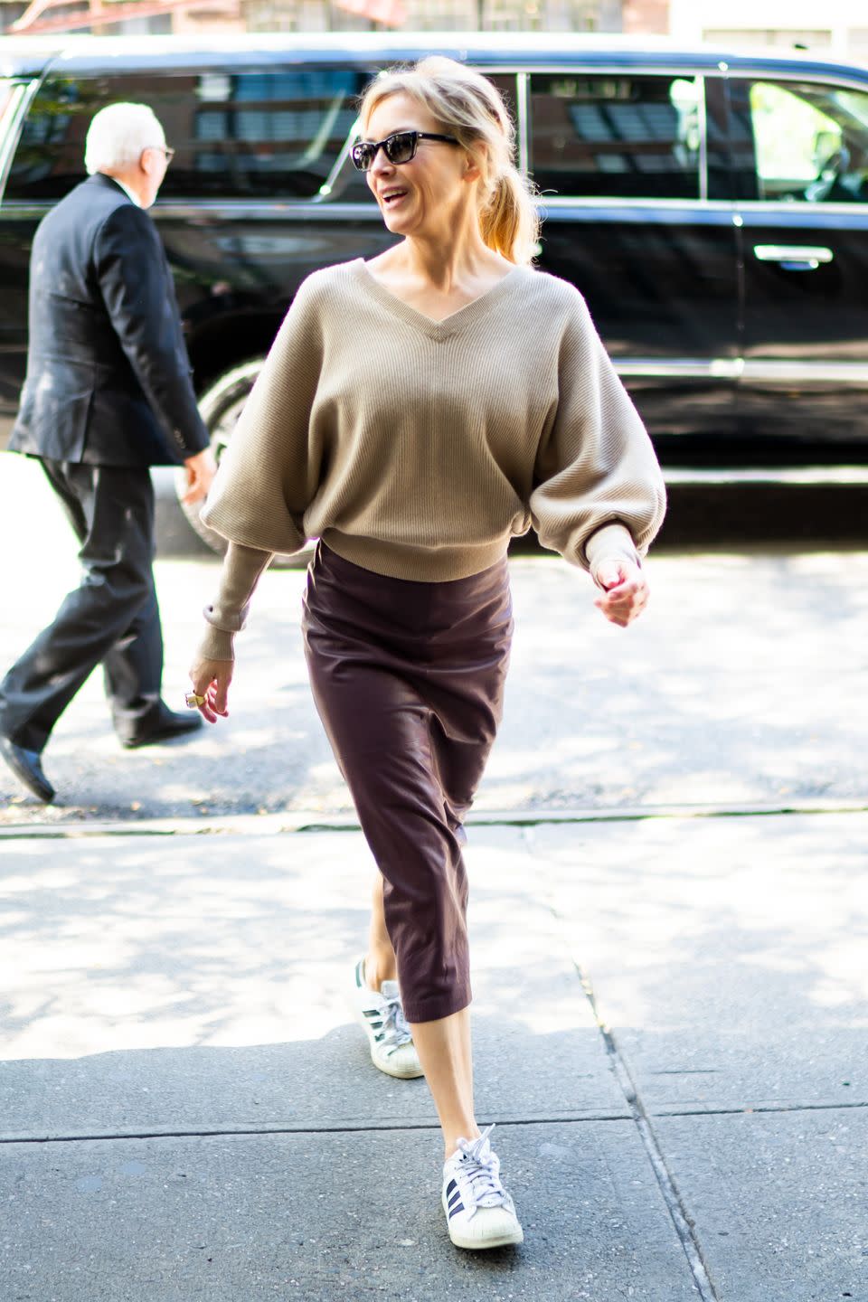 <p>A cozy sweater paired with a streamlined leather pencil skirt is an evergreen combination. But do as <a href="https://www.townandcountrymag.com/leisure/arts-and-culture/a29026941/renee-zellweger-judy-garland-interview/" rel="nofollow noopener" target="_blank" data-ylk="slk:Renee Zellweger;elm:context_link;itc:0;sec:content-canvas" class="link ">Renee Zellweger</a> did and throw in a surprise—sporty accessories like Adidas sneakers and a smart watch—to give the look an unexpected air of casual nonchalance.</p>