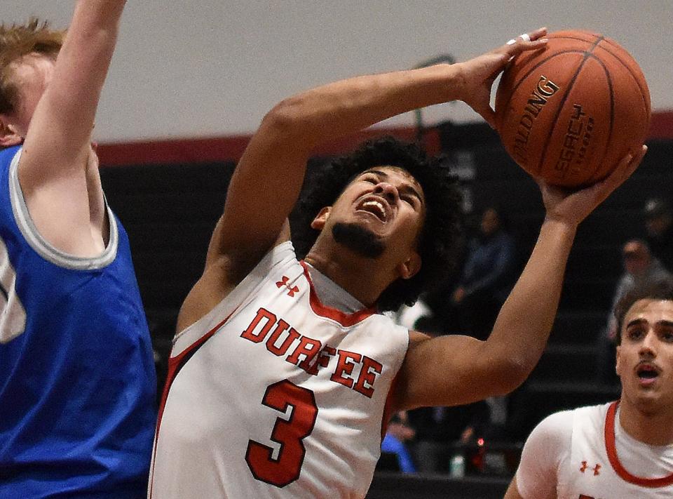 Durfee's Jeyden Espinal goes up strong against a Braintree defender during a recent non-league contest at B.M.C. Durfee High School Feb. 16, 2024.