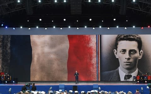 French President Emmanuel Macron stands and speaks during an event to commemorate the 75th anniversary of the D-Day landings - Credit: Daniel Leal-Olivas/AFP