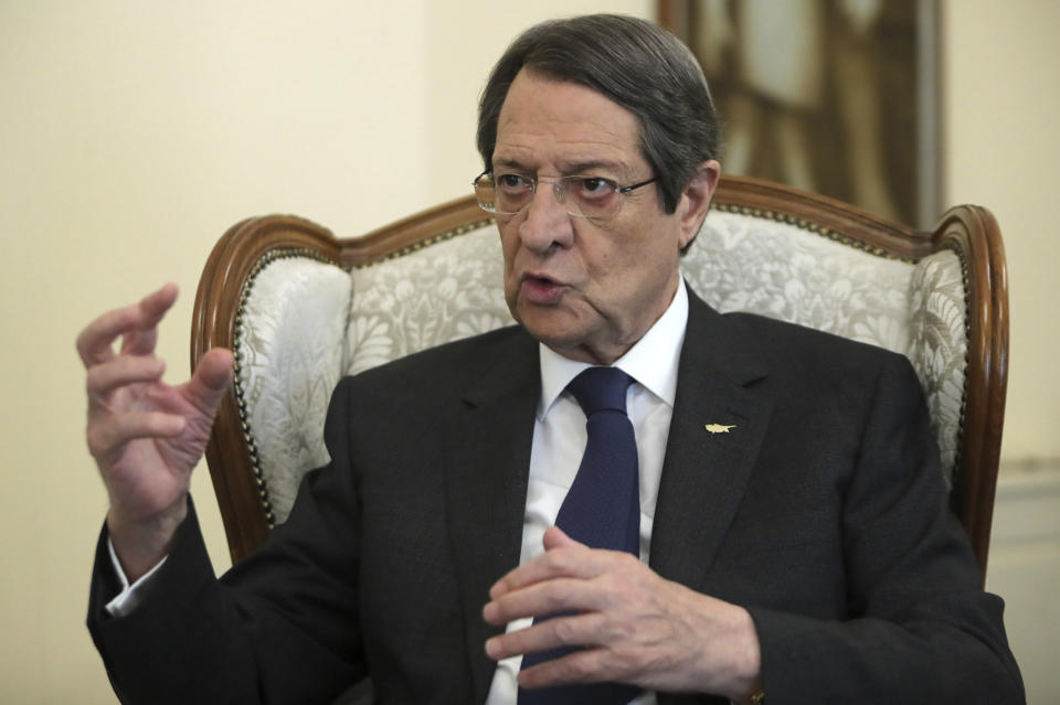 Cyprus' president Nicos Anastasiades talks during an interview with the Associated Press at the presidential palace in capital Nicosia, Cyprus, Tuesday Sept. 17, 2019. Anastasiades says Turkey's "obsession" to permanently station troops, secure military intervention rights and extend its influence over Turkish Cypriots in any peace deal is fanning fears that it wants to turn the island into a "protectorate." (AP Photo/Petros Karadjias)