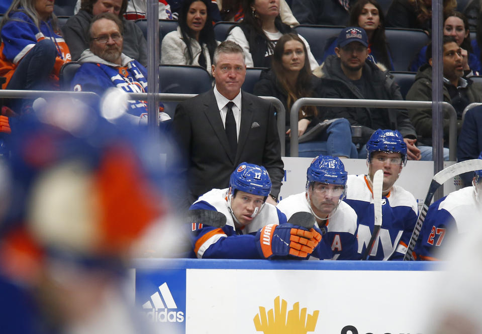 New York Islanders head coach Patrick Roy stands behind the bench during the first period of an NHL hockey game against the Florida Panthers, Saturday, Jan. 27, 2024, in Elmont, N.Y. (AP Photo/John Munson)