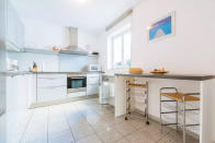 <p>The kitchen is stark, modern and well-equipped.<br>(Airbnb) </p>