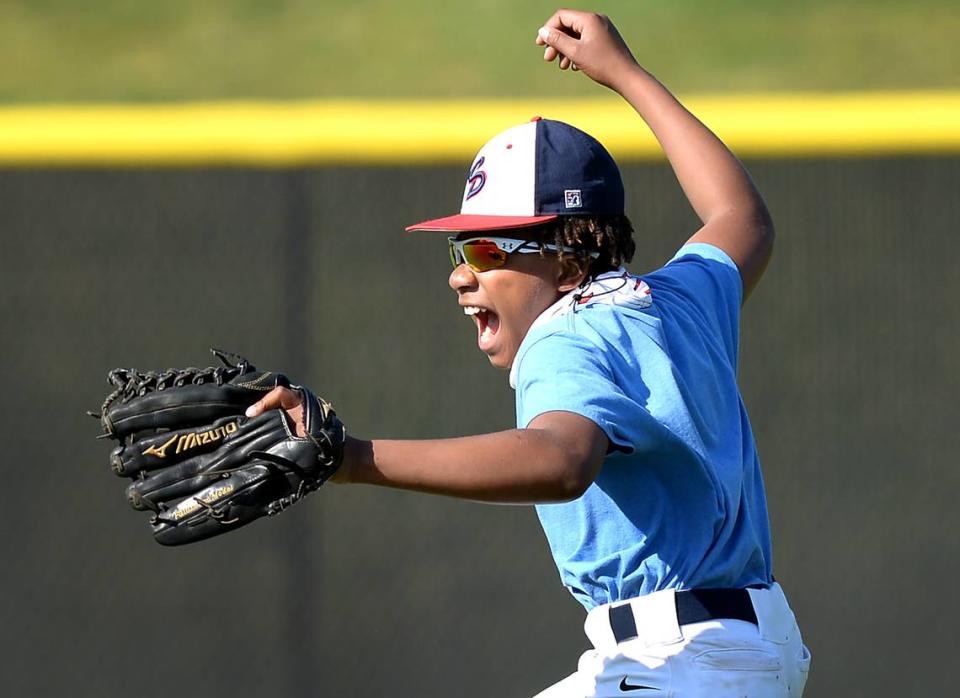 Joshua Scott jokes around during a pregame workout on Thursday, April 14, 2021. Joshua is a die-hard Philadelphia Phillies fan who has recently appeared on ESPN and other outlets for an act of generosity. Joshua and his father, James Scott attended a Atlanta Braves vs Philadelphia Phillies game where Joshua caught a home run ball hit by Freddie Freeman. Rather than throwing the ball back onto the field, Joshua found a young Braves fan wearing a Freeman t-shirt and gave the ball to him. Joshua plays on the Covenant Day School junior varsity baseball team.