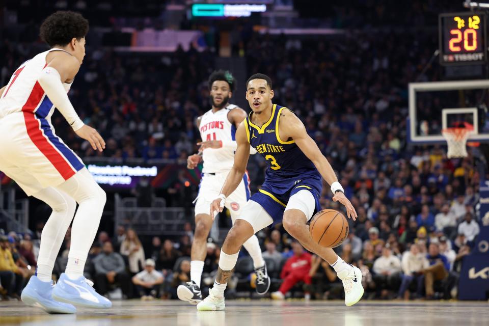 Jordan Poole (3) of the Golden State Warriors is guarded by Killian Hayes (7) of the Detroit Pistons in the first half at Chase Center on January 4, 2023 in San Francisco, California.