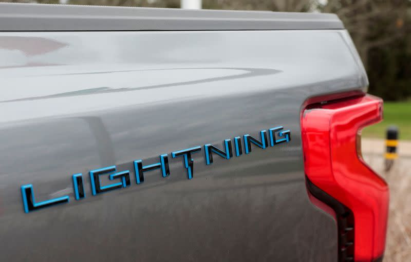 FILE PHOTO: The Lightning logo is seen on the side of a Ford F-150 Lightning electric pickup truck