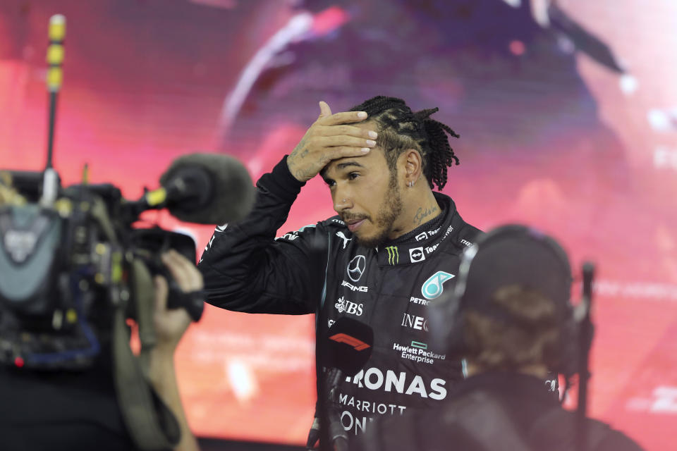 Mercedes driver Lewis Hamilton of Britain reacts after finishing second in the Formula One Abu Dhabi Grand Prix in Abu Dhabi, United Arab Emirates, Sunday, Dec. 12. 2021. Max Verstappen ripped a record eighth title away from Lewis Hamilton with a pass on the final lap of the Abu Dhabi GP to close one of the most thrilling Formula One seasons in years as the first Dutch world champion. (AP Photo/Kamran Jebreili, Pool)