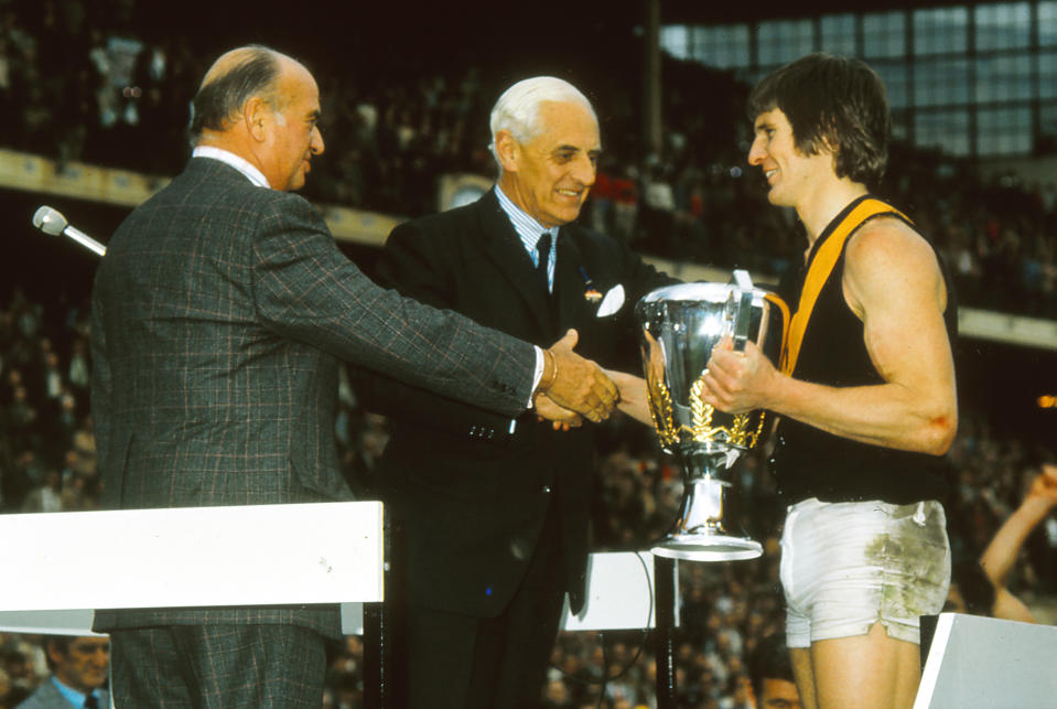 MELBOURNE, AUSTRALIA - SEPTEMBER 28:  Royce Hart of the Tigers holds the trophy after the VFL Grand Final between the Richmond Tigers and the North Melbourne Kangaroos at the Melbourne Cricket Ground on September 28, 1974 in Melbourne, Australia. (Photo by Getty Images) 