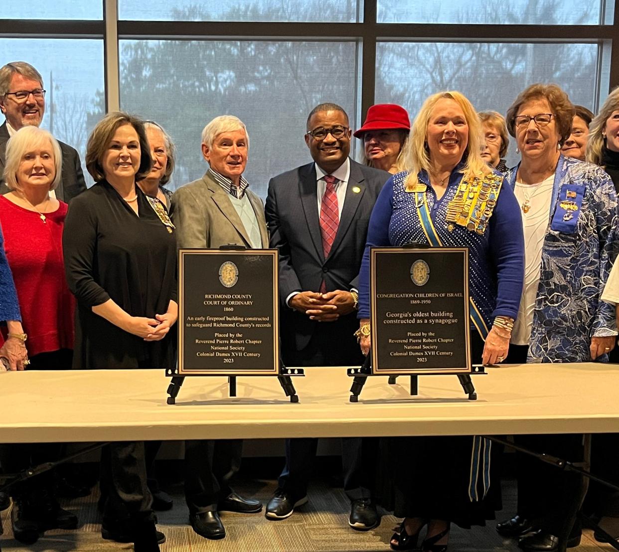 Augusta Mayor Garnett Johnson, center-right, Augusta Jewish Museum board President Jack Weinstein, center-left, and several community members dedicated historical markers for the old Telfair Street synagogue in a ceremony in the Augusta Municipal Building on Sunday, Jan. 22, 2022.