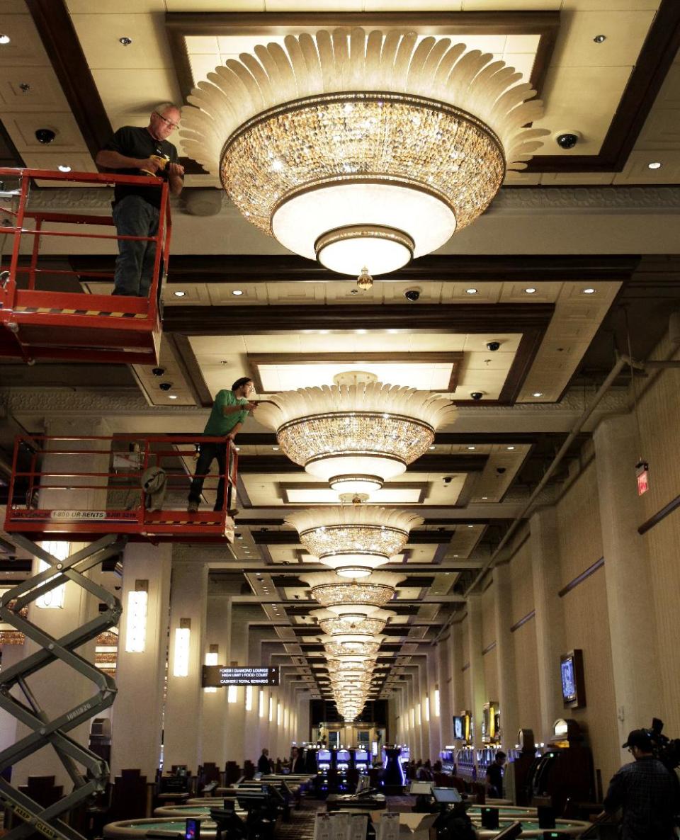 Workers put the finishing touches on a gaming floor at the Horseshoe Casino Cleveland in Cleveland on Wednesday, May 9, 2012. Located in the city’s old Higbee department store, the $350 million project is scheduled to open to the public on Monday, May 14. (AP Photo/Amy Sancetta)