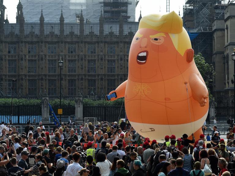 Baby Trump balloons heading to US after protests in Britain depict US president as angry orange infant
