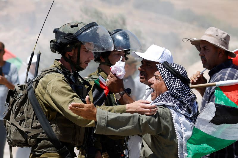 Palestinians protest against Israeli settlement activity in Al Mughayyir village