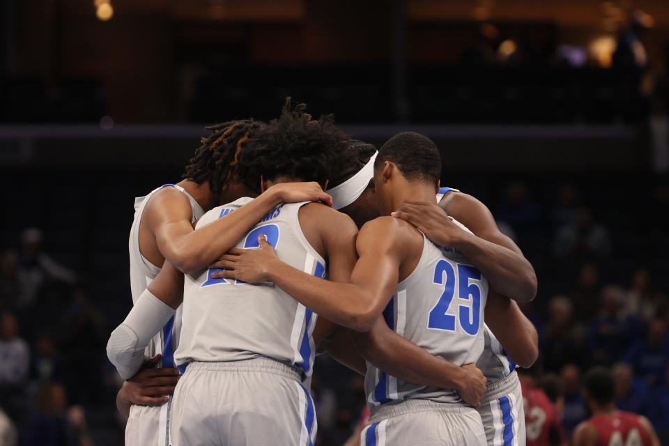 Memphis Tigers players huddle up before their game against North Carolina Central at FedExForum on Saturday, Nov. 13, 2021. 