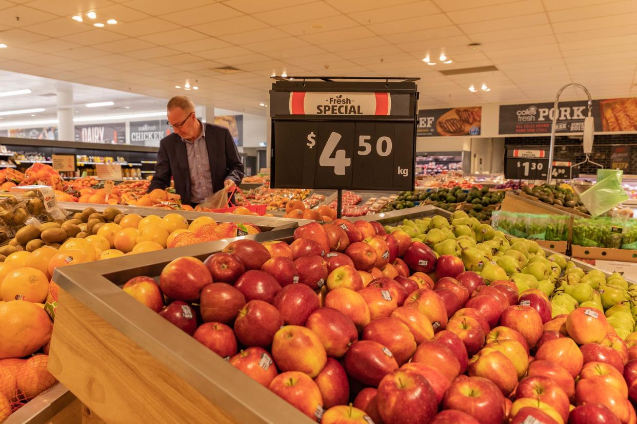 People shopping for fruit and vegetables 