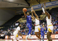 Kansas guard Joseph Yesufu (1) lays up a shot in front of Iona guard Ryan Myers, center right, and forward Nelly Junior Joseph, right, during the second half of an NCAA college basketball game Sunday, Nov. 28, 2021, in Lake Buena Vista, Fla. (AP Photo/Jacob M. Langston)