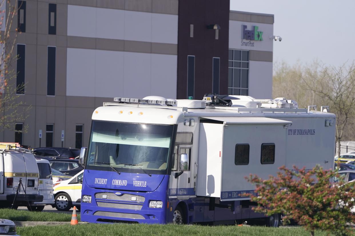 A crime scene vehicle is stationed where multiple people were shot at the FedEx Ground facility early Friday morning, April 16, 2021, in Indianapolis.