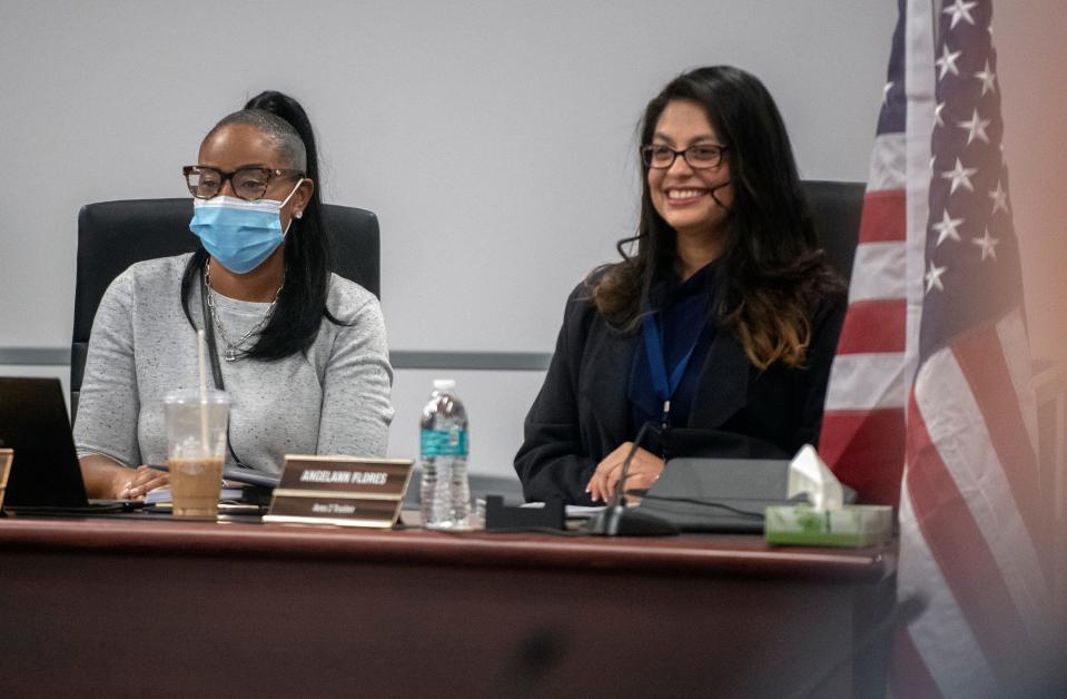 New SUSD board trustee Kenneth Steves, left and incumbent trustee AngelAnn Flores take their places on the dais after being sworn in at the board meeting on Dec. 13, 2022. 