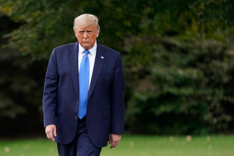 President Donald Trump walks to speak to members of the press on the South Lawn of the White House in Washington, Thursday, Sept. 24, 2020, before boarding Marine One for a short trip to Andrews Air Force Base, Md. Trump is traveling to North Carolina and Florida. (AP Photo/Patrick Semansky)