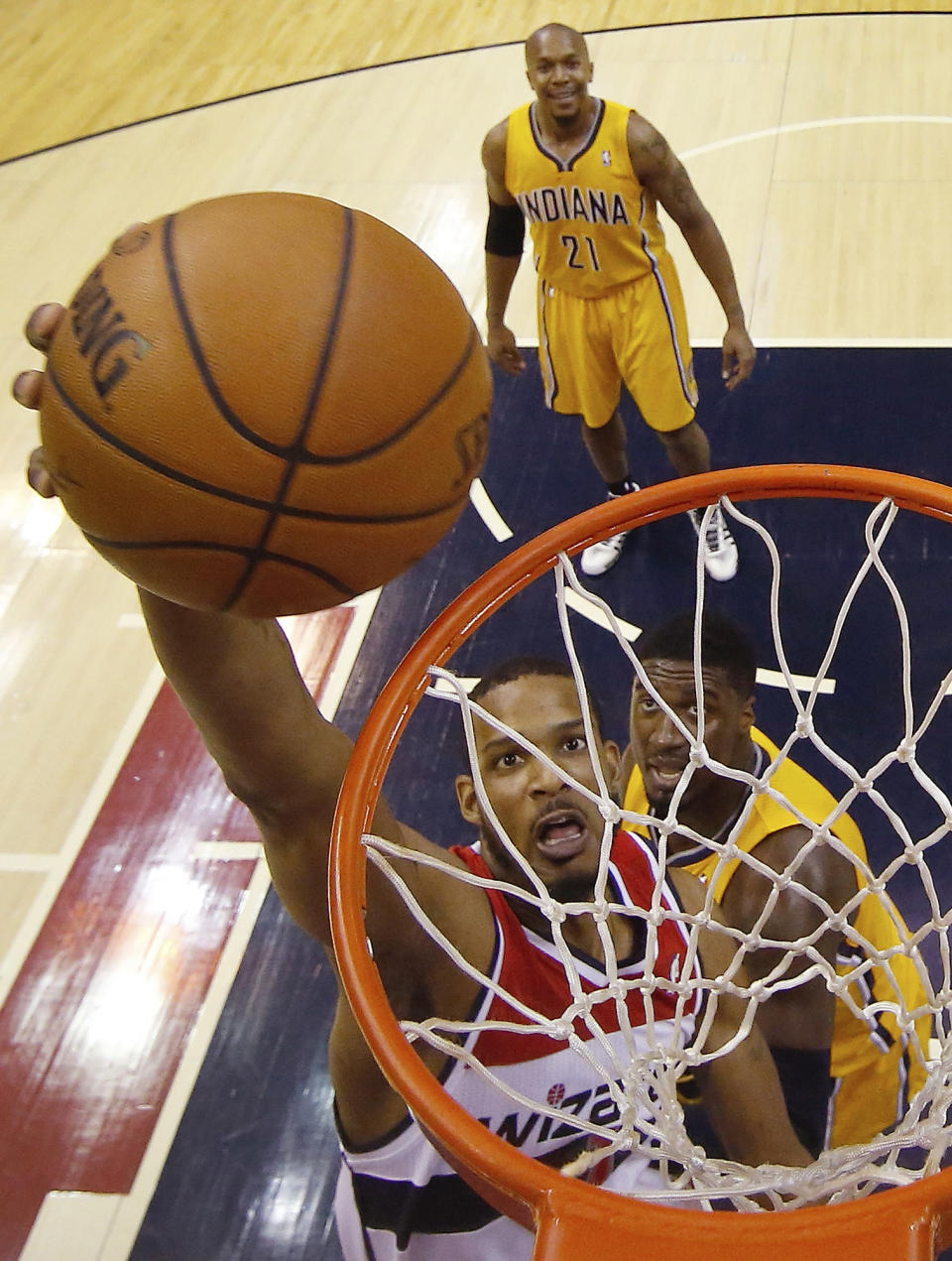 Washington Wizards forward Trevor Ariza (1) shoots past Indiana Pacers center Roy Hibbert (55) during the first half of Game 3 of an Eastern Conference semifinal NBA basketball playoff game in Washington, Friday, May 9, 2014. (AP Photo/Alex Brandon)