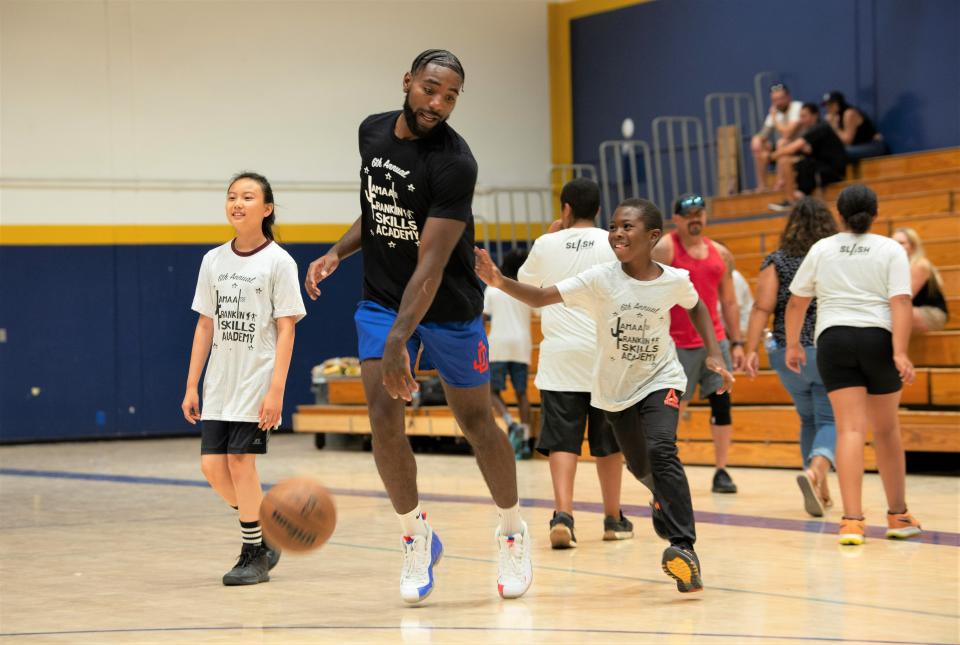 Jordan Campbell, an Adelanto High School graduate, dribbles a ball during the Jamaal Franklin’s Skill Academy on Saturday, Aug. 5, 2023, at Serrano High School. More than 100 kids from the ages of 6 to 16 attended Franklin's camp at his alma mater.