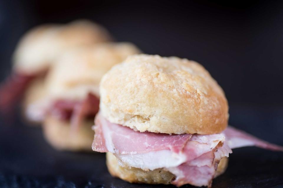 <p><strong>Country Ham Biscuit</strong></p><p>Virginia is rightfully the birthplace of this southern charm. Created in Smithfield, the Country Ham Biscuit, country ham, a fluffy biscuit and honey mustard. It’s been commercialized since where it’s even on the McDonald’s breakfast menu. Enjoy one at <a href="http://www.scratchbiscuit.com/" rel="nofollow noopener" target="_blank" data-ylk="slk:Scratch Biscuit Company;elm:context_link;itc:0;sec:content-canvas" class="link ">Scratch Biscuit Company</a>. </p>