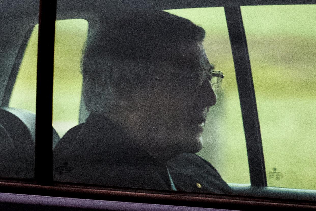 Cardinal George Pell sits in the back seat of a car as he leaves prison in Melbourne on Tuesday: AP