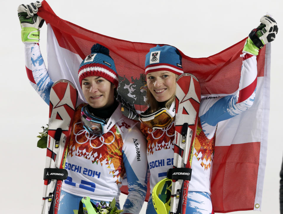 Women's slalom winners from Austria Kathrin Zettel (bronze) and Marlies Schild (silver) pose for photographers at the Sochi 2014 Winter Olympics, Friday, Feb. 21, 2014, in Krasnaya Polyana, Russia. (AP Photo/Gero Breloer)