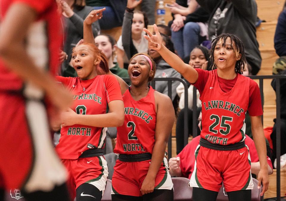 Lawrence North Wildcats forward Ashiyah Teague (0), Lawrence North Wildcats Ka'Nyriah Ridley (2) and Lawrence North Wildcats guard Ke'Andriah Butler (25) yell in excitement Thursday, Dec. 7, 2023, during the game at Lawrence Central High School in Indianapolis. The Lawrence Central Bears defeated the Lawrence North Wildcats, 57-55.