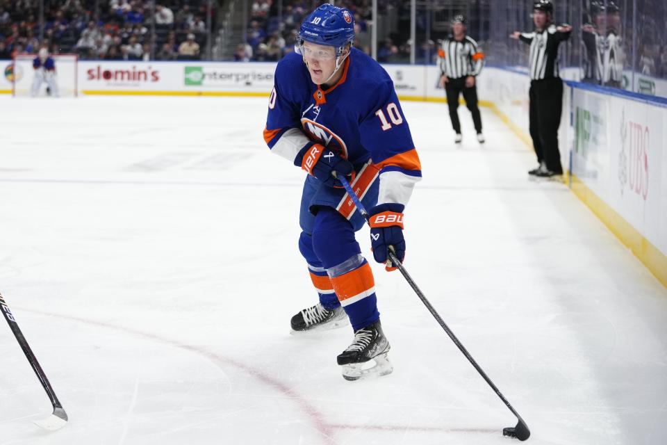 New York Islanders' Simon Holmstrom looks to pass the puck during the second period of the team's NHL hockey game against the Colorado Avalanche on Tuesday, Oct. 24, 2023, in Elmont, N.Y. (AP Photo/Frank Franklin II)