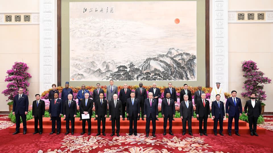 Chinese leader Xi Jinping, Russian President Vladimir Putin and other leaders pose for a group photo during the Belt and Road Forum in Beijing last month. - Shen Hong/Xinhua/Getty Images