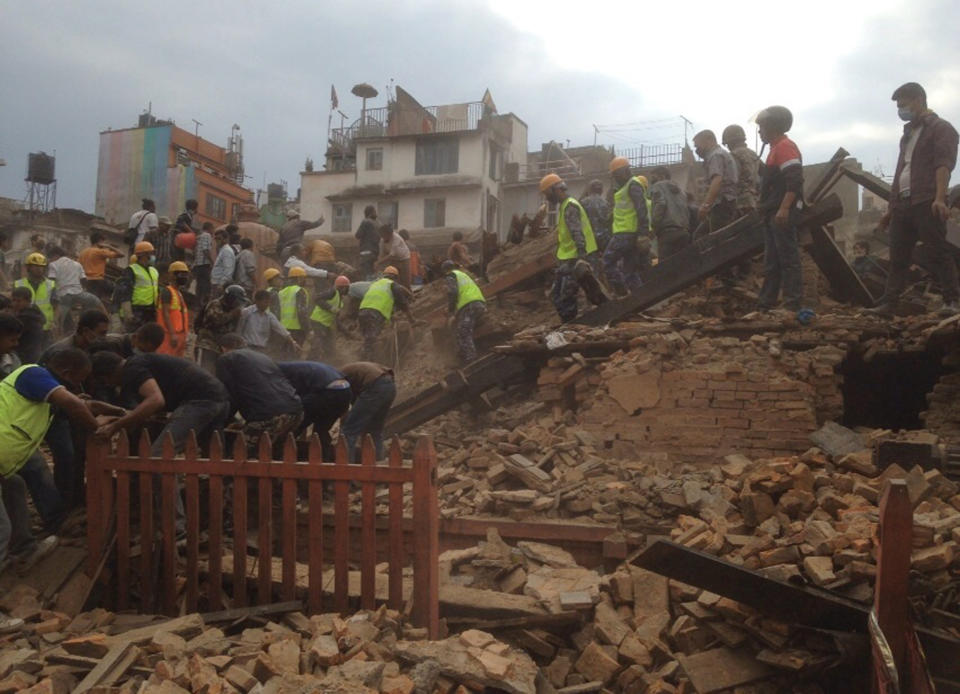 Rescuers clear the debris at Durbar Square. (AP Photo/ Niranjan Shrestha)