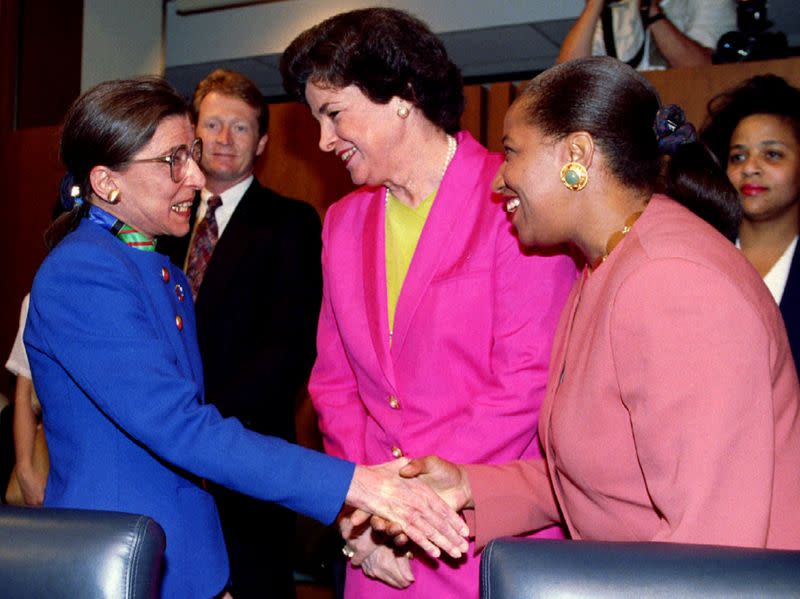 FILE PHOTO: U.S. President Clinton's first Supreme Court nominee Ginsburg is greeted by Dianne Feinstein (D-CA) and Carol Moseley-Braun prior to the opening of Ginsburg's confirmation hearings on Capitol Hill