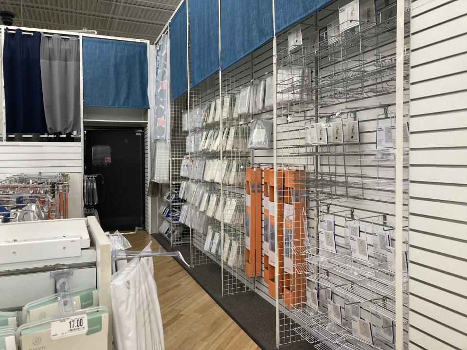 Nearly empty shelves are seen at a Bed Bath & Beyond store, April 10, 2023 in Naples, Fla. Bed Bath & Beyond has filed for bankruptcy protection, but the company says its stores and websites will remain open and continue serving customers. The beleaguered home goods chain made the filing Sunday, April 23 in U.S. District Court in New Jersey, listing its estimated assets and liabilities in the range of $1 billion and $10 billion. (AP Photo/Anne D'Innocenzio)
