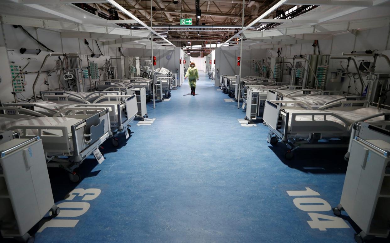 A medical staff member takes part in a fire drill to evacuate the Corona Treatment Center Jaffestrasse, a makeshift hopsital currently without patients, amid the coronavirus disease (COVID-19) outbreak in Berlin, Germany, November 26, 2020. REUTERS/Fabrizio Bensch - FABRIZIO BENSCH/REUTERS