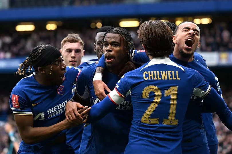 Carney Chukwuemeka of Chelsea celebrates with teammates after scoring his team's third goal during the Emirates FA Cup Quarter Final between Chelsea FC and Leicester City FC at Stamford Bridge on March 17, 2024 in London, England.