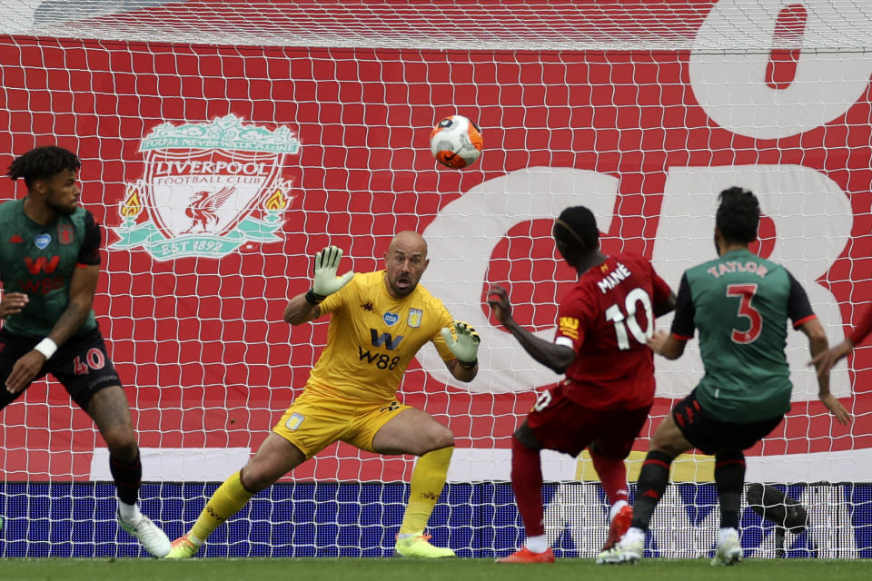 Liverpool's Sadio Mane, 2nd right, scores the opening goal during the English Premier League soccer match between Liverpool and Aston Villa at Anfield Stadium in Liverpool, England, Sunday, July 5, 2020. (Carl Recine/Pool via AP)