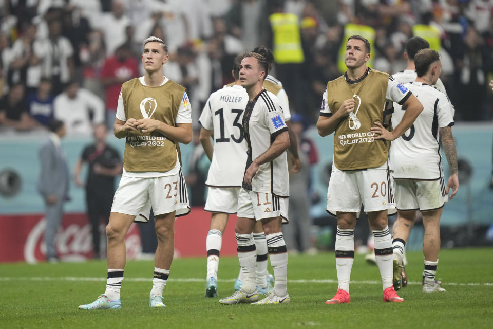 Germany's players leave the pitch at the end of the World Cup group E soccer match between Costa Rica and Germany at the Al Bayt Stadium in Al Khor, Qatar, Friday, Dec. 2, 2022. (AP Photo/Darko Bandic)